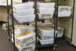 Ballots wait to be processed at the Clackamas County Elections office, May 18, 2022. A printing error on Clackamas County primary election ballots has led to turmoil that will likely take weeks to solve.
