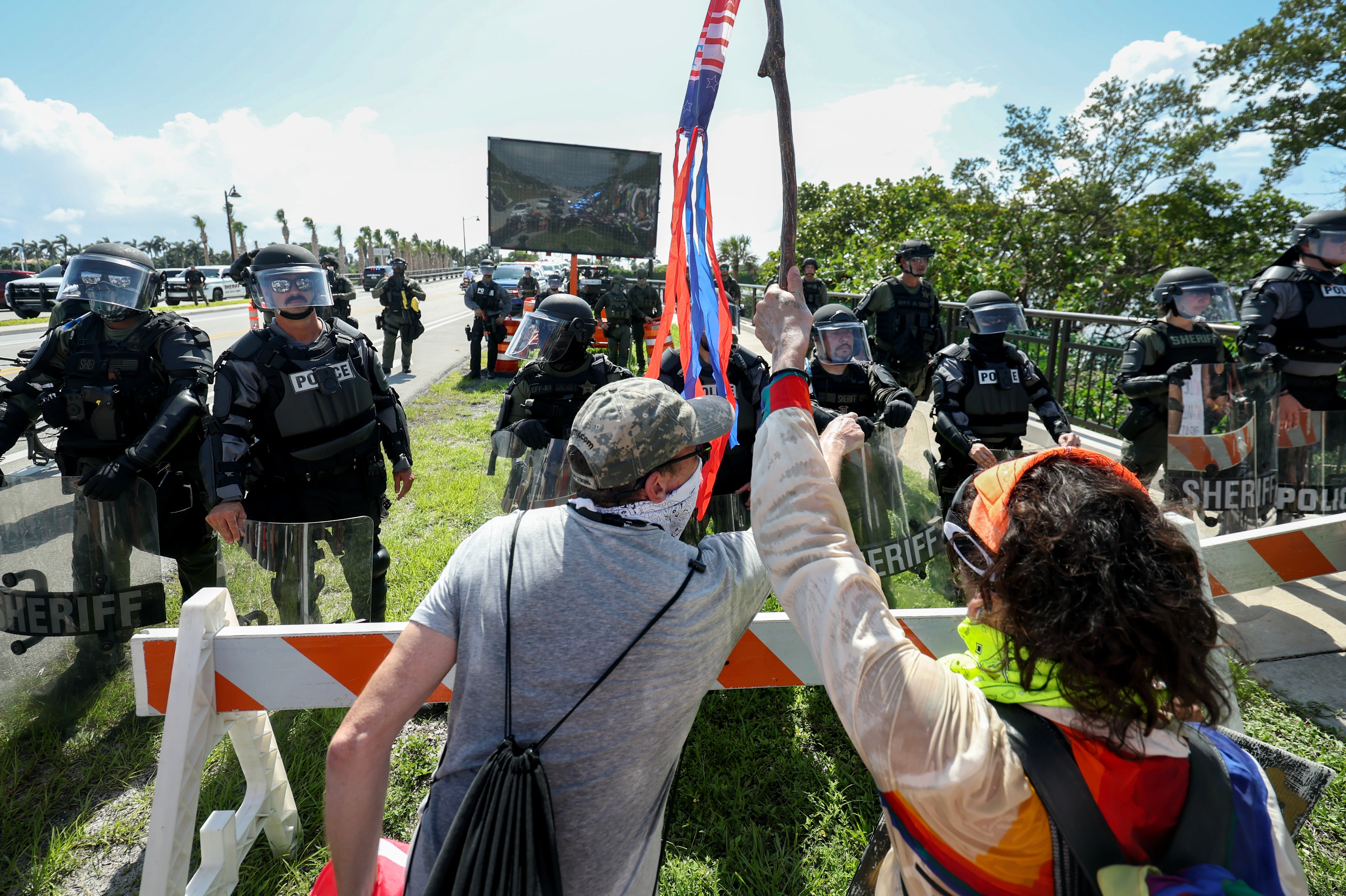 West Palm Beach, Fla.: Palm Beach Sheriff officers keep protesters from crossing a bridge to President Donald Trump's Mar-a-Lago home.