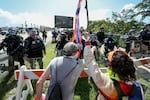 West Palm Beach, Fla.: Palm Beach Sheriff officers keep protesters from crossing a bridge to President Donald Trump's Mar-a-Lago home.