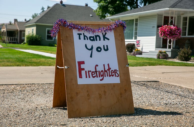 A "thank you firefighters" sign outside of a house in Baker City, Ore., Jul 31, 2024. Baker City has served as a hub for firefighting efforts during the Badland Complex fires. 