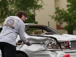 A student swings a sledgehammer with force into the back of a vehicle for Eastern Oregon University's annual "Car Smash" on June 3, 2026.
