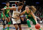 FILE: Oregon guard Sabrina Ionescu, right, drives to the basket against Mississippi State guard Jordan Danberry, left, during the second half of a regional final in the NCAA women's college basketball tournament on March 31, 2019, in Portland, Ore. Portland is once again hosting women's tournament games in 2024.