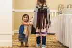 Akane Ironheart, 18 months, citizen of the Sauk-Suiattle tribal nation, and two other young girls wear wool shawls woven by her mother, Stephanie Ironheart, an enrolled member of the Cheyenne and Arapaho Tribes of Oklahoma.