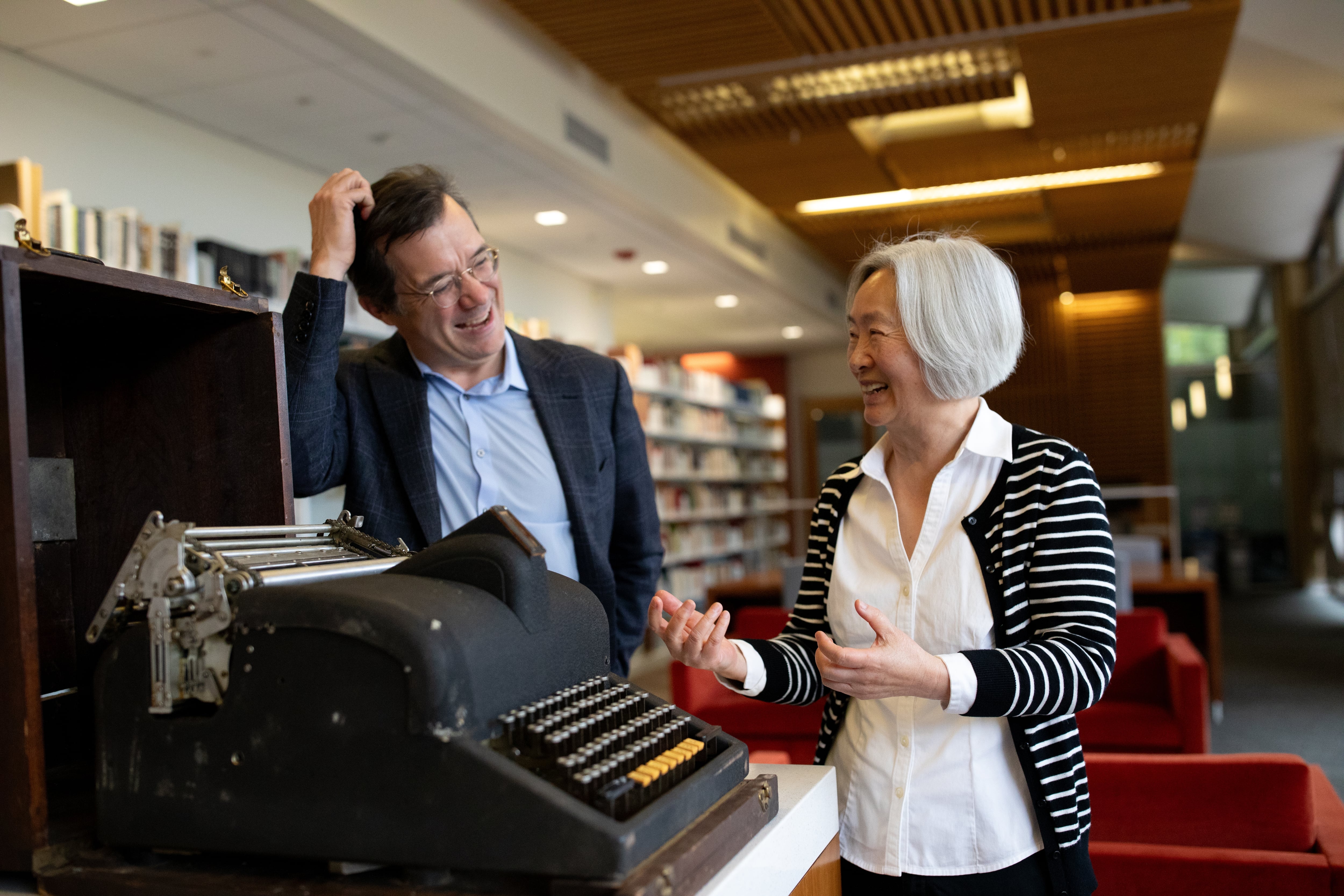 Thomas Mullaney and Zhaohui Xue, curator for Chinese studies, examine the MingKwai prototype at Stanford University.