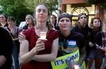 Nurses Bobbi Sue McColllum, left, and Jennifer Suarez at the candlelight vigil outside Legacy Good Samaritan Medical Center July 29, 2023. Suarez says too often nurses are told to accept being hit, kicked and threatened as part of their job.