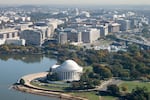 The Jefferson Memorial and US Capitol are seen alongside the Tidal Basin in an aerial photograph taken on approach to Ronald Reagan Washington National Airport near Washington, DC, on October 22, 2024. 