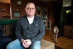 Evan Mackie sits in his living room on Jan. 27, 2020, in Aumsville, Ore. The former NORPAC worker described his job search as slow.