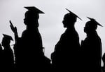 New graduates line up before the start of the Bergen Community College commencement in East Rutherford, N.J, May 2018. The "One Big Beautiful Bill” contains proposals that could significantly reshape the higher education landscape, change how some Oregon students pay for college, and how graduates pay back their student loans.
