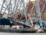 In this photo provided by the U.S. Army Corps of Engineers, salvors with the Unified Command prepare charges for upcoming precision cuts to remove Section 4 from the port side of the bow of the Dali container ship, May 7, 2024, during the Key Bridge Response, in Baltimore.