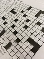 A black and white crossword grid.