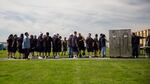 Men incarcerated at Two Rivers Correctional Institution wait to re-enter the prison following a community event Aug. 24, 2019, in Umatilla, Ore.