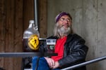 Don Impson enjoys a beer at Walking Man Brewing Company in Stevenson, Wash., Thursday, May 14, 2020. Walking Man opened its beer garden to customers as Skamania County entered the first phase of reopening amid the COVID-19 pandemic.