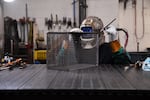 A welder works on a basket at Marlin Steel's Baltimore factory on March 22, 2023.