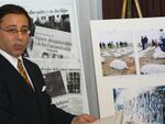 A file photo from 2007 show lawyer Jonathan Reiter discussing a lawsuit against Chiquita Brands International, speaking next to newspaper clippings and photos displaying stories of alleged torture and killing by Colombian paramilitaries who were paid by the banana giant.