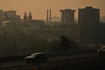 Smoke hangs over downtown Spokane after a wildfire hit the northern part of Spokane, Wash., Tuesday, Aug. 4, 2026.
