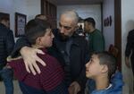 Ashraf Zeghayer with his nephews after the israeli army arretsed their father and some of Ashraf's family members, Ashraf is a released palestinian prisinor, photo taken on the 25 of Jan date of his release, Afif H. Amireh for NPR.