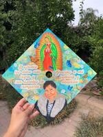 Citlaly Arroyo-Juarez's graduation cap honors her grandmother who died in Mexico due to COVID-19. The artwork is by Mikayla Hernandez.