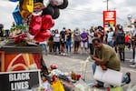A man visits a makeshift memorial honoring George Floyd on May 26, 2020 in Minneapolis.