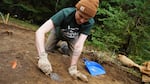 Archaeologist Elliot Helmer digging around a large deer bone in the Maxville excavation site, Sept. 11, 2024.