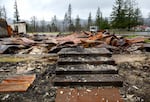 A file photo from 2021 shows lingering devastation from the 2020 Beachie Creek Fire in Gates, Oregon. Senate Bill 1520, which limits taxes on wildfire survivors as they recover, is heading to the governor's desk.