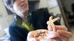 Oregon State University marine ecologist Jessica Miller examining a Northern Pacific sea star collected from the Japanese dock that washed ashore in Newport, Oregon. The giant piece of debris came from the 2011 earthquake and tsunami disaster.