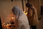 Worshippers light candles during Easter Sunday Mass at Saint Sarkis Cathedral, an Armenian Apostolic church, in Tehran, Iran, Sunday, April 5, 2026. 