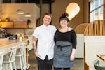 Chefs Siobhan Speirits and Taylor Manning standing inside their restaurant, Cafe Olli, in Portland, Ore.