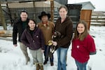 At left, Yakama Nation aviary biologists Michael Beckler and Alyssa Woodward pose for a photo with Yakama Nation Tribal Council member Terry Heemsah, center, as Washington State University wildlife veterinarian Dr. Marcie Logsdon holds a juvenile golden eagle rehabilitated at WSU’s College of Veterinary Medicine. To Logsdon's right is WSU veterinary technician Alexis Adams. Picture taken Jan. 25, 2024 before the eagle was released into the tribe's aviary. 