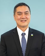 Tigard City Councilor Yi-Kang Hu is seeking the mayor's seat recently vacated by Heidi Lueb.