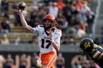 Oregon State quarterback Ben Gulbranson (17) looks to throw as California linebacker Liam Johnson (15) moves in during the second half of an NCAA college football game in Berkeley, Calif., Saturday, Oct. 26, 2024.