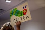 A protester holds up a sign to demonstrate against a bill in Tennessee that would have allowed public schools to prevent undocumented students from attending.