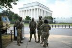 Members of the U.S. National Guard patrol near the Lincoln Memorial in Washington on Saturday. President Trump called on governors in South Carolina, Ohio and West Virginia to send hundreds of additional troops to curb violent crime in Washington, as he seeks to make good on his campaign pledge to be a "law and order" president.