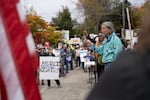 U.S. House Rep. Maxine Dexter addresses protestors, encouraging them to vote in the upcoming midterm elections.