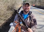 Jake Cowart holds a piece of metal he fished out of Georgia's Yellow River using his neodymium magnet.