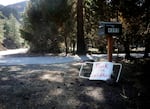 A sign that says "Thank you firefighters" leaning against a mailbox.