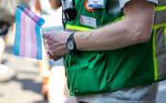 FILE - A participant in the Portland Trans Pride March holds a flag on July 20, 2024. Organizer's of Molalla's Pride event have cancelled plans after being targeted by threats from far-right groups.