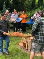 Members of the Confederated Tribes of Grand Ronde hold a first foods ceremony with a traditionally harvested salmon.