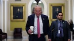 Senate Majority Leader Charles Schumer of New York walks to his office at the U.S. Capitol on Thursday.