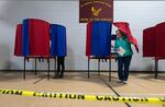 A voter leaves a polling booth at St. Anthony Community Center in Manchester, N.H., during the state's presidential primary on Jan. 23.