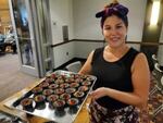 Syreeta Azure holds a tray of ‘eel pate.’