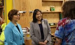 Acting Labor Secretary Julie Su, right, and U.S. Rep. Suzanne Bonamici speak with students at the International Brotherhood of Electrical Workers training center in Portland, Ore., on Feb. 23, 2024.