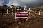 A memorial stands on the side of the highway that runs through Lahaina.