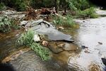 A severely damaged road is closed near Bear Mountain State Park following a night of heavy rain and flooding is pictured on Monday in Highland Falls, New York.