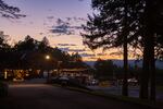 While most of the crowds are eating dinner and getting ready for the night’s festivities, security guards enjoy the quiet sunset while one final volleyball match concludes.