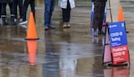 Over 50 people were waiting in line for a COVID-19 test at the Oregon Convention Center testing site operated by Curative, Jan. 6, 2022. A staff member told people in line that the wait was 45-60 minutes. Getting access to tests has become increasingly challenging.