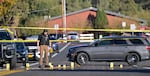 Numbers mark evidence as police investigate a fatal shooting at Silver Rail Elementary School in Bend, Ore., Oct. 15, 2026.