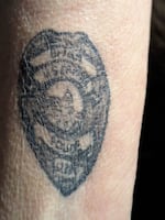 Gladys Sicknick’s son, Brian, served in the U.S. Capitol Police and was assaulted with pepper spray on Jan. 6, 2021. He died the following day. After his death, Gladys got a tattoo of his badge on her forearm.