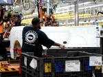 A worker works at Ford's Rouge Electric Vehicle Center in Dearborn, Michigan on Sept. 20, 2022. The higher labor costs will hurt the Big Three's competitiveness but one analyst said it won't be a "death knell."