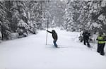 Austin Patch, assistant watermaster for the Oregon Water Resources Department, takes a snow core sample Monday, Feb. 27, 2023, at the Ski Bowl Road snow course in Southern Oregon. Snowpack at the site is 88% of median as of March 1.