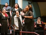 Coty Raven Morris, a Portland State University assistant professor of choir, music education and social justice, is shown leading a PSU choir during a concert performance of "From the Dust" at First Congregational  Church in Portland in November 2023. Morris was nominated as a semifinalist for a GRAMMY Music Educator Award in September 2024 for the second consecutive year.